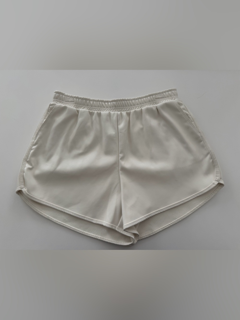 Goldie Cream Pleather Shorts — Smooth Curved Hem